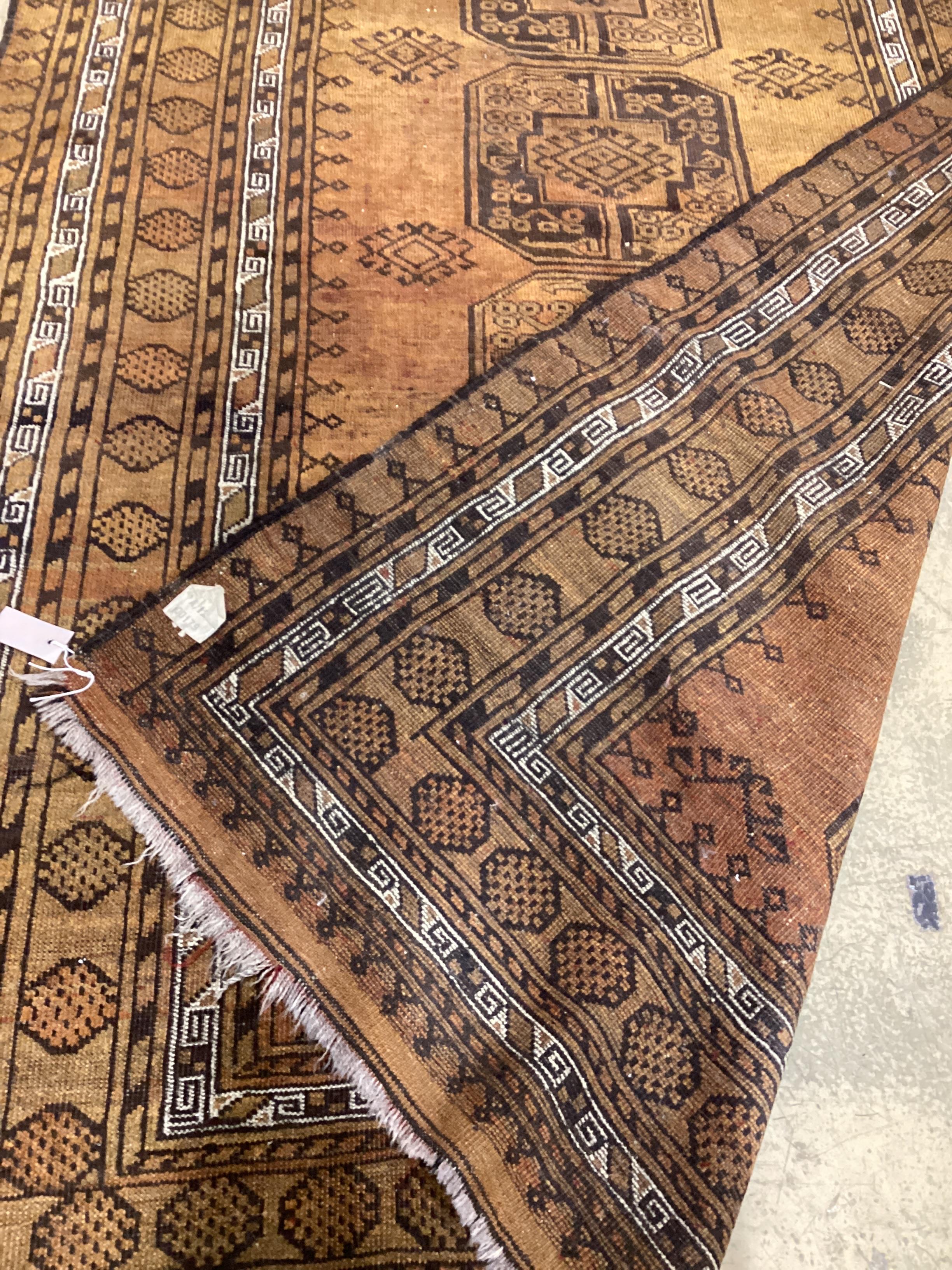 An Afghan gold ground rug, 224 x 151cm